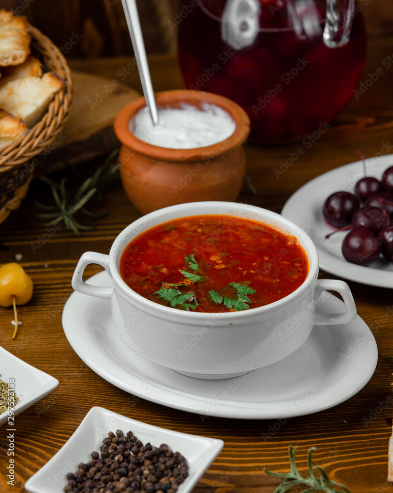 tomato soup is in the bowl served with mayonnaise tomato soup is in the bowl served with mayonnaise