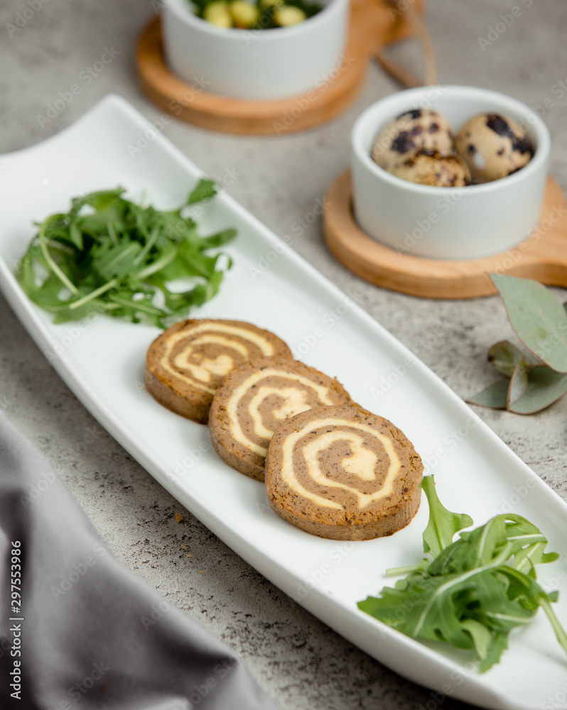 decorated three pates with greens in the plate decorated three pates with greens in the plate