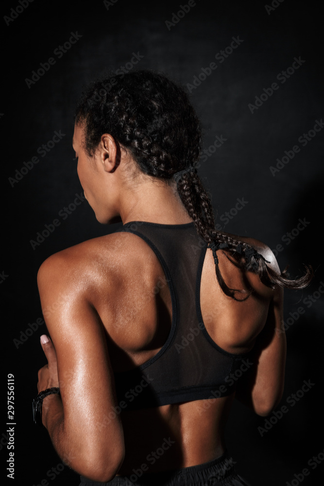 Naklejka premium Image from back of beautiful african american woman in sportswear