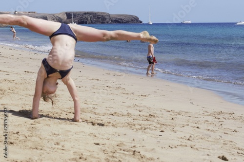girl gymnast on beach