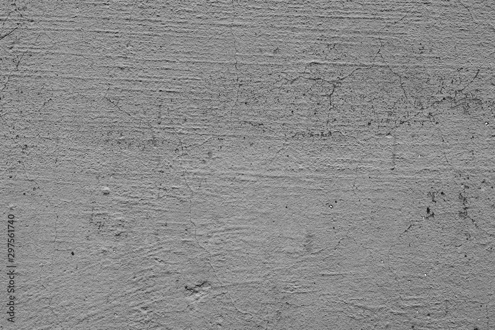 Texture of a concrete wall with cracks and scratches which can be used as a background Texture of a concrete wall with cracks and scratches which can be used as a background