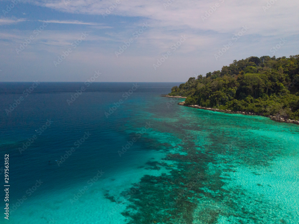 Fototapeta premium A diving trip in the crystal clear water in front of a lonely island in Southeast Asia