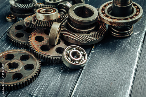 Car parts gears and bearings on wooden background © fotofabrika