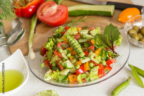 Fresh colorful vegetable salad in plate. Cooking healthy diet food