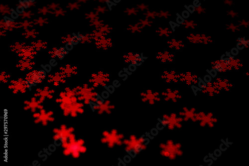 red snowflake glitter sparkle isolated on black background