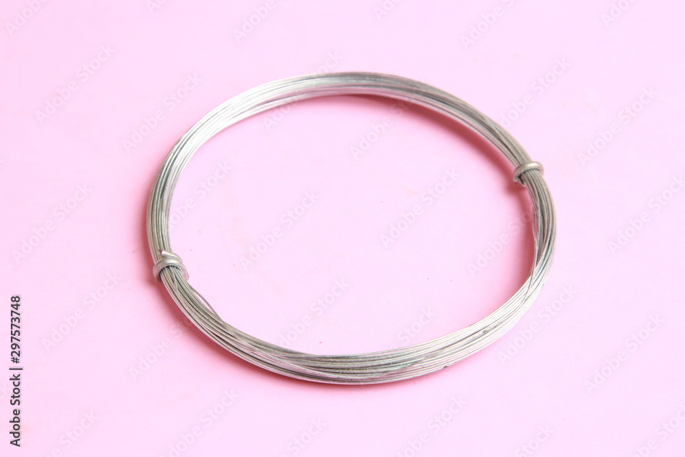 roll of metal wire of hardware store on colored background roll of metal wire of hardware store on colored background