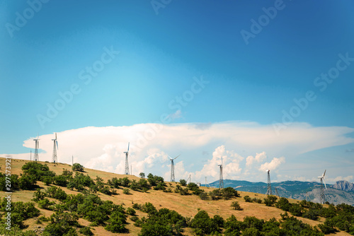 Wind power plant against the blue sky