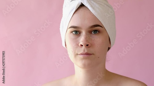 Young Woman with collagen pads under her eyes on pink background. Spa, skincare, beauty, cosmetics, wellness concept