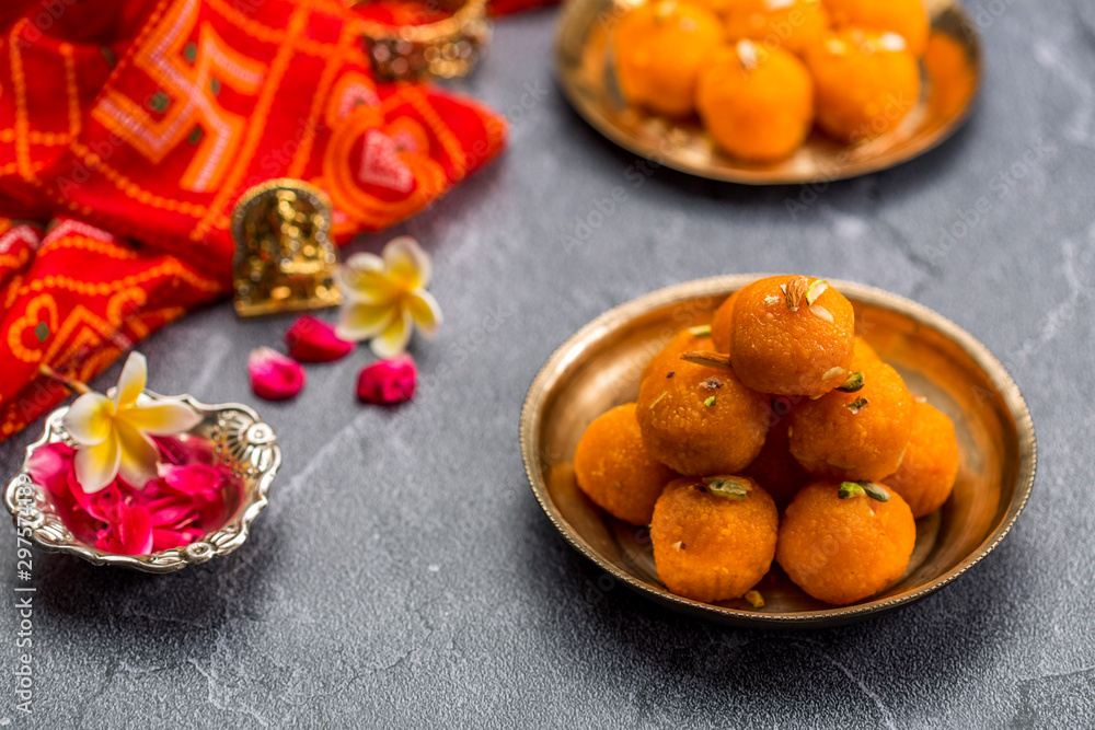 Motichoor Ladoo or Laddu - made from fine bundi, ball shaped sweets popular in indian subcontinent cooked with sugar, ghee or oil Motichoor Ladoo or Laddu - made from fine bundi, ball shaped sweets popular in indian subcontinent cooked with sugar, ghee or oil