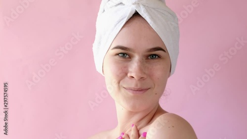 Young Woman with collagen pads under her eyes on pink background. Spa, skincare, beauty, cosmetics, wellness concept