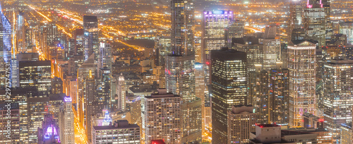 Panorama aerial view illuminated skyscrapers in downtown Chicago at dusk