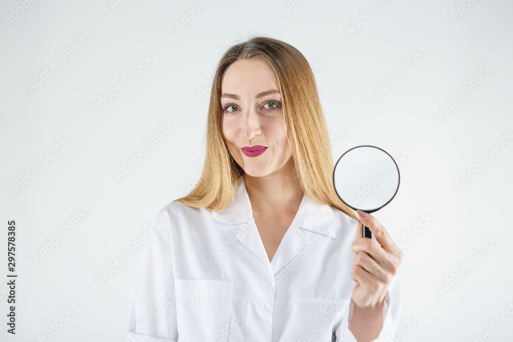 Female doctor with a magnifier in hands Female doctor with a magnifier in hands