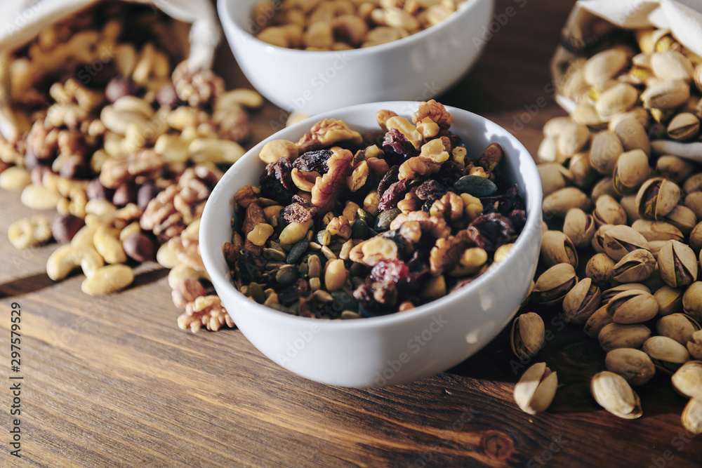 white bowl with mixed nuts and dry fruits white bowl with mixed nuts and dry fruits
