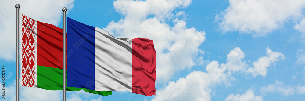 Belarus and France flag waving in the wind against white cloudy blue sky together. Diplomacy concept, international relations. Belarus and France flag waving in the wind against white cloudy blue sky together. Diplomacy concept, international relations.