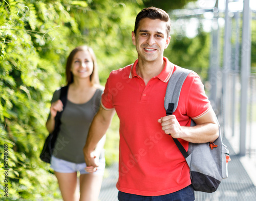 Man and his girlfriend are walking and resting