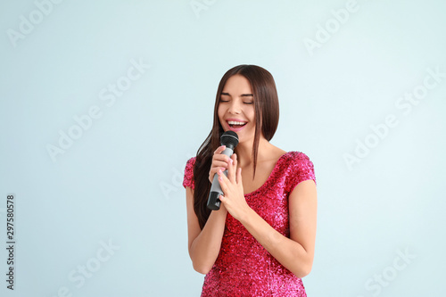 Beautiful young female sing...