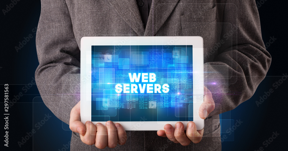 Young business person working on tablet and shows the inscription: WEB SERVERS