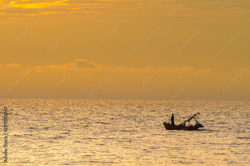 fishing boat in sunset.