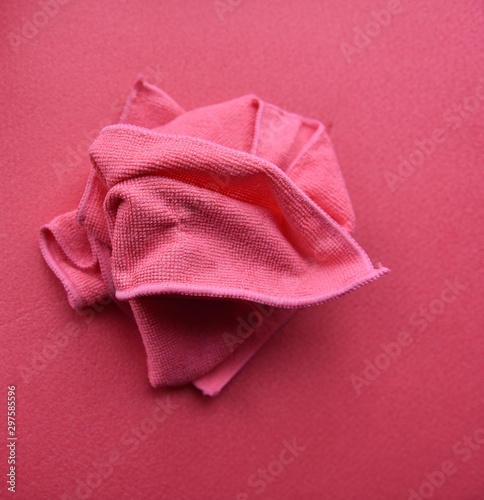 pink towels in a fold on a pink background
