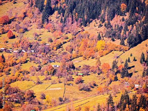 Carpatian village at mountains at the sunny day photo