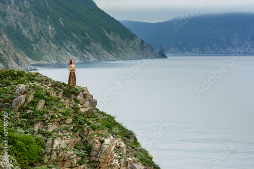 Long-haired girl on sea shore