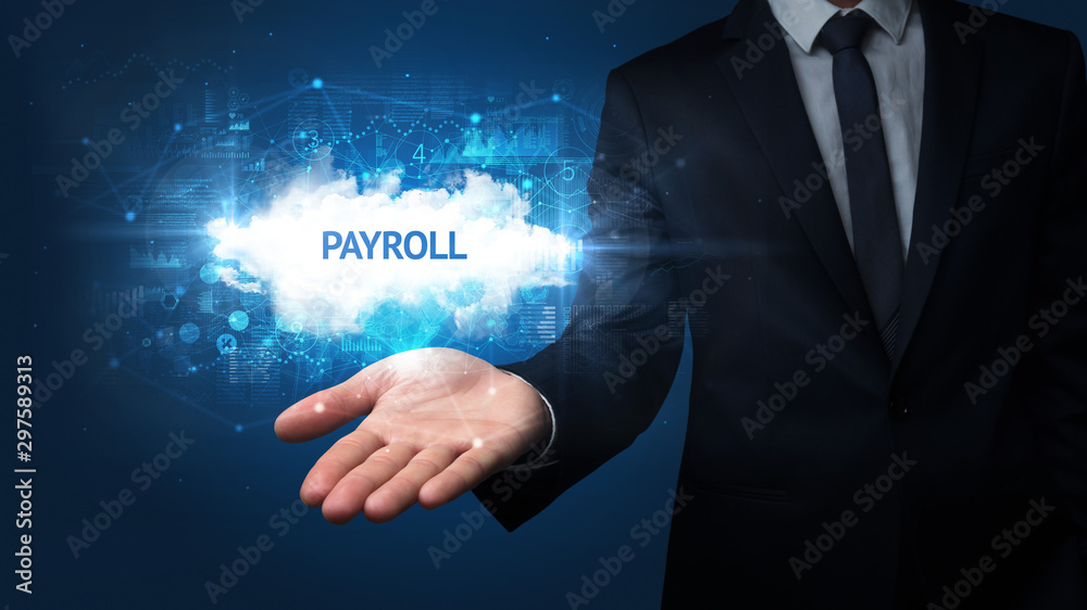 Fototapeta premium Hand of Businessman holding PAYROLL inscription, successful business concept
