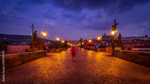 Morning runner on Charles Bridge. Holidays in Prague