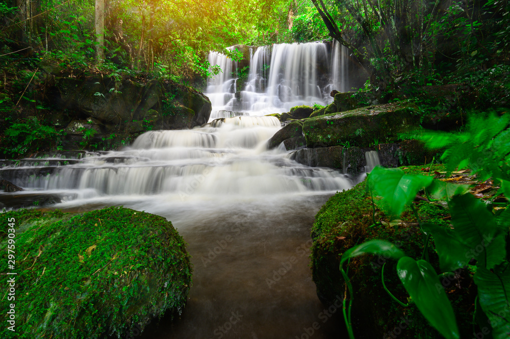 A beautiful waterfall deep in the tropical forest, steep mountain adventure in the rainforest. A beautiful waterfall deep in the tropical forest, steep mountain adventure in the rainforest.