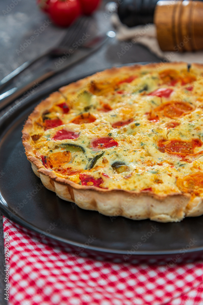 vegetable pie with cherry tomatoes, grilled peppers and courgettes with fresh eggs and fresh cream vegetable pie with cherry tomatoes, grilled peppers and courgettes with fresh eggs and fresh cream