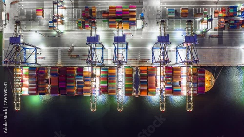 Aerial view container cargo ship at industrial port in import export business logistic and transportation of international by container cargo ship in the open sea.
