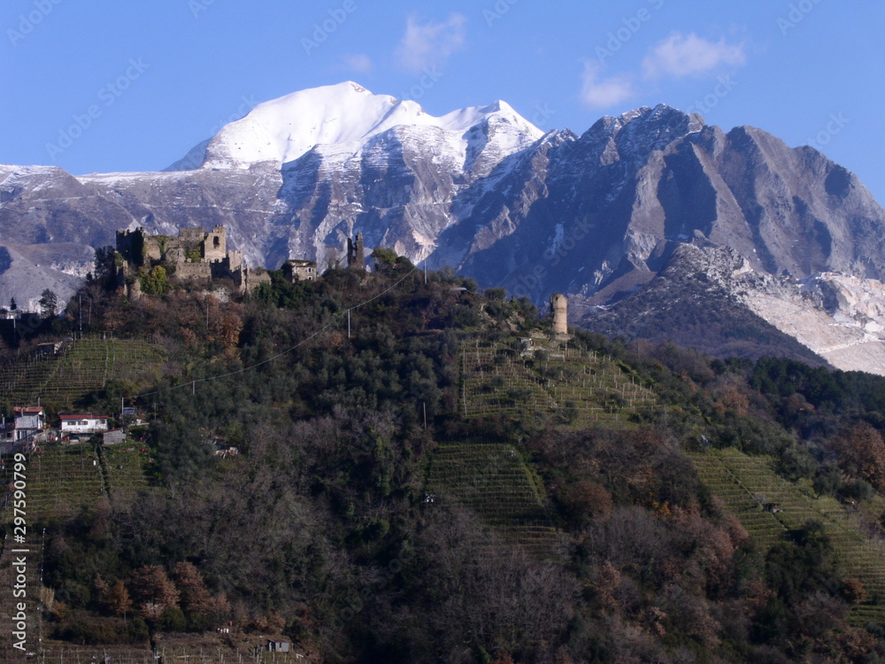 Ancient castle of Moneta located on a hill near the city of Carrara. In the background, Monte Sagro and the Apuan Alps.