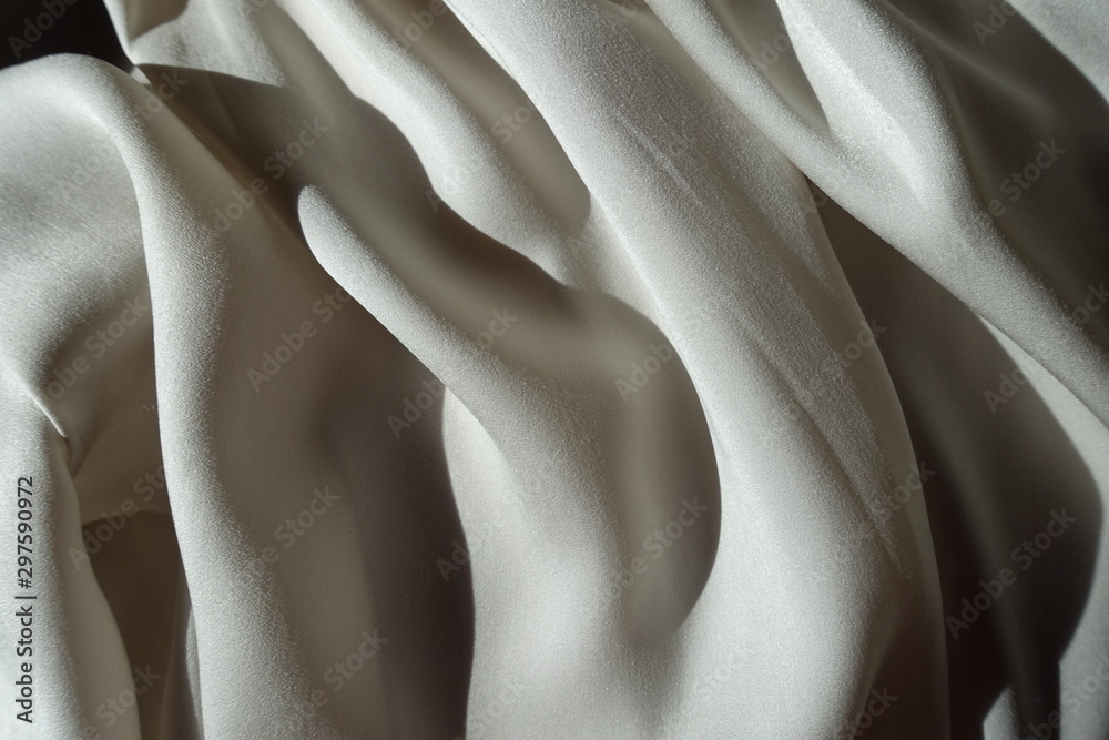 Folded thin shiny light grey chiffon fabric Folded thin shiny light grey chiffon fabric