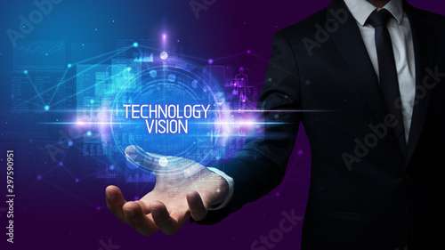 Man hand holding TECHNOLOGY VISION inscription, technology concept