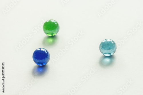 Glass colored balls on a white background. Abstract background. Shallow depth of field (DOF)