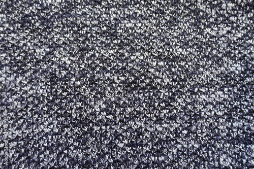 Texture of dark blue melange woolen fabric