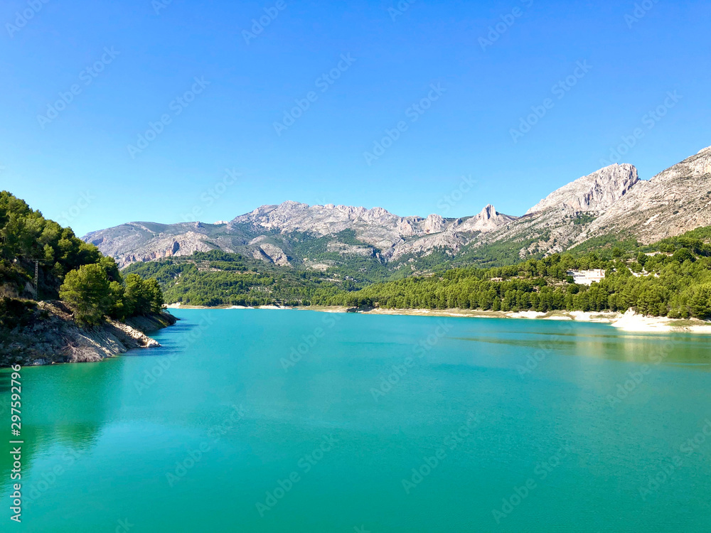 The beautiful azure coloured water of the reservoir at Guadalest in Spain