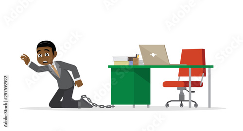 African Businessman being chained to a desk.