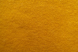 Texture of amber yellow woolen knitted fabric