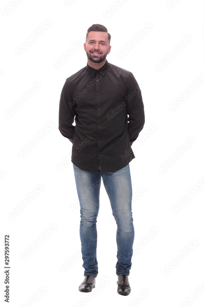 in full growth. a young man in jeans and a black shirt.