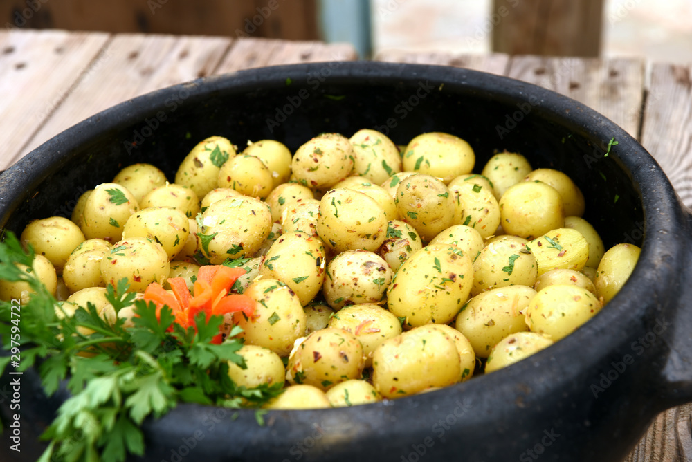 whole baked potatoes on your skin with spices and herbs