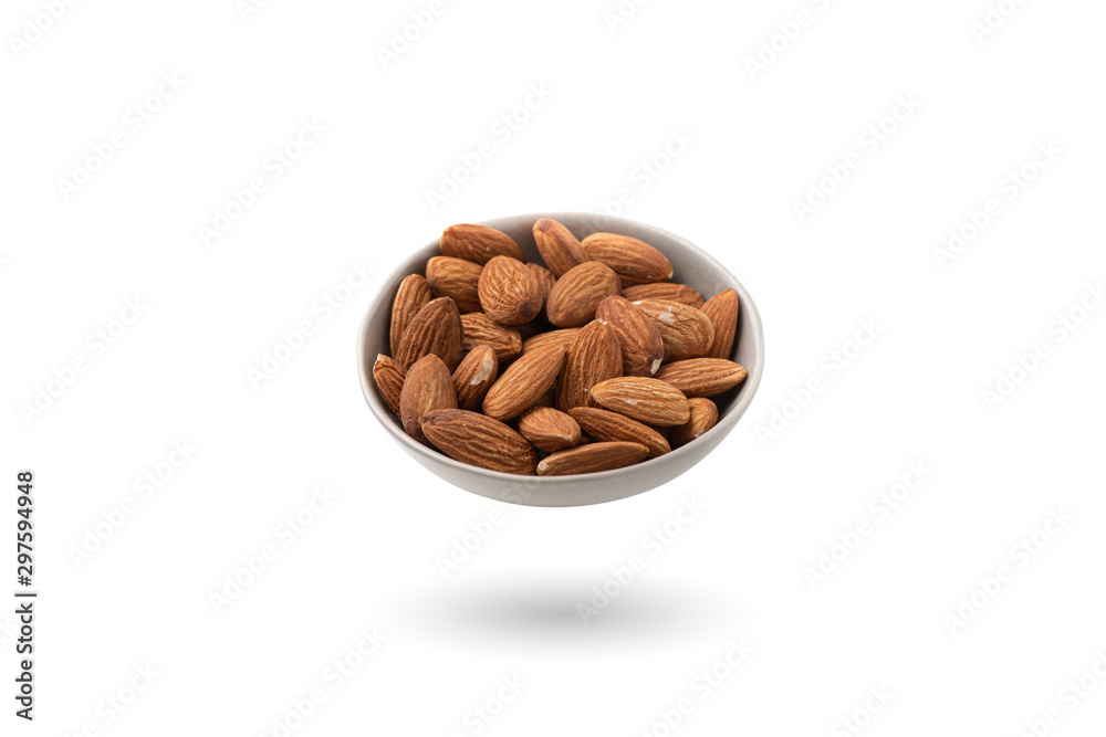 almonds in a bowl isolated on white background almonds in a bowl isolated on white background