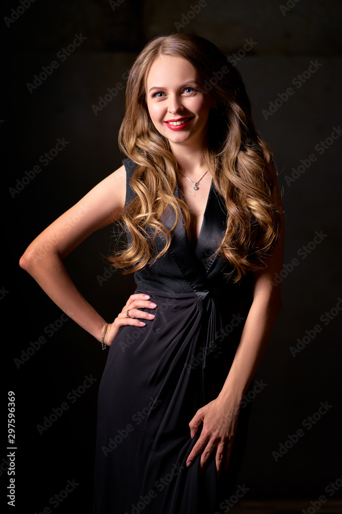 Close up studio Portrait of Beautiful smiling caucasian woman with long hair against black background Close up studio Portrait of Beautiful smiling caucasian woman with long hair against black background