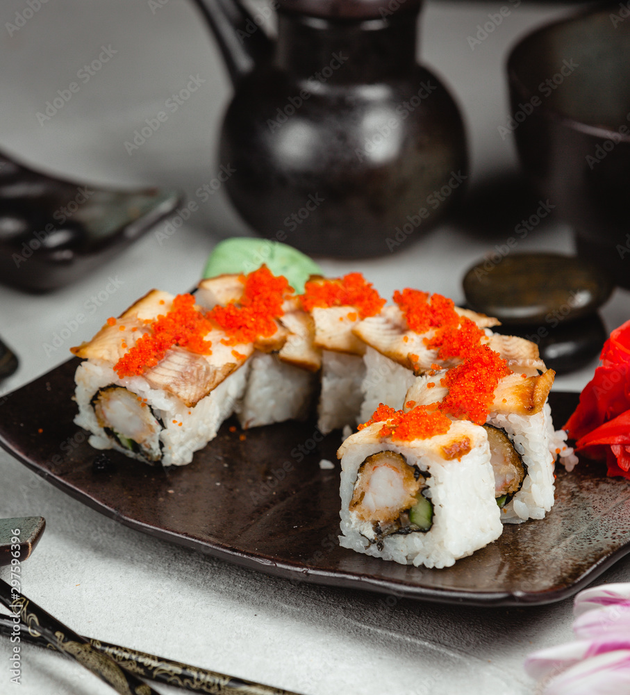 unagi rolls topped with eel and red tobiko unagi rolls topped with eel and red tobiko