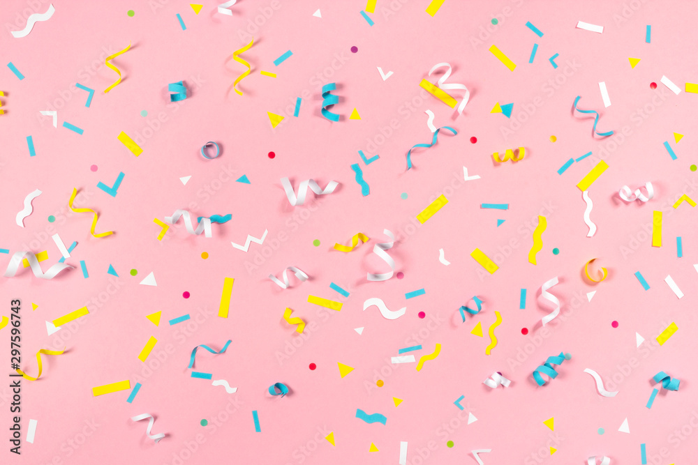 Colorful paper confetti exploding on pastel pink background - obrazy, fototapety, plakaty 