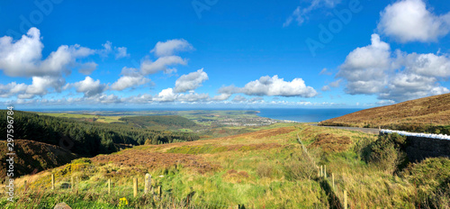 The mountain road across the Isle of Man looking towards the coastal town of Ramsey and the Irish Sea