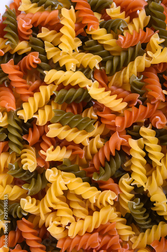  Raw tagliatelle pasta isolated on white background.