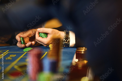 Chips in the hands of a player in a casino.