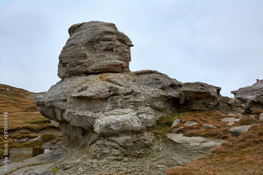 Peak Baba Mare, stone in the Bucegi Natural Park in Romania. Megaliths on top of a mountain range, tourist attraction.