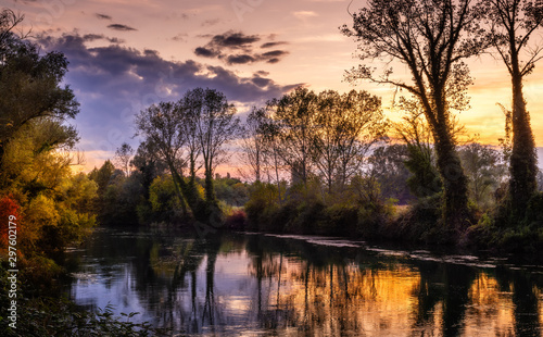 Autumn sunset on the river Sile at Casale sul Sile (Italy). Trees and countryside landscape © Alberto Agnoletto