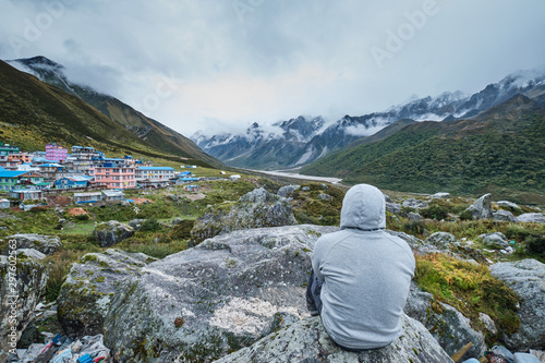 A person overlooking Kyanjin Kharka Village photo